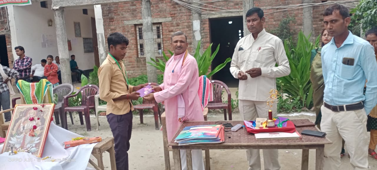 Chairman handing an award to a student